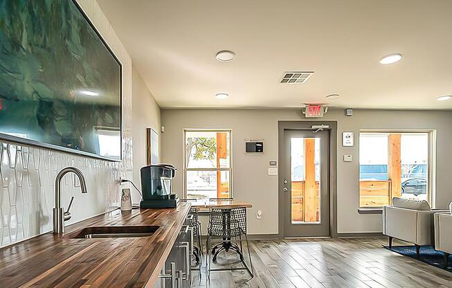 a large kitchen with stainless steel appliances and wooden cabinets