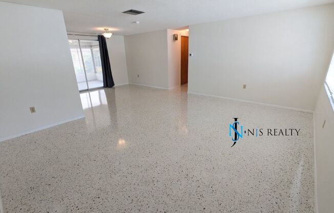 Large open 2/2/1 1378 Sq. Ft. with freshly finished floors, fresh paint, new appliances and located near the heart of Downtown New Port Richey!!