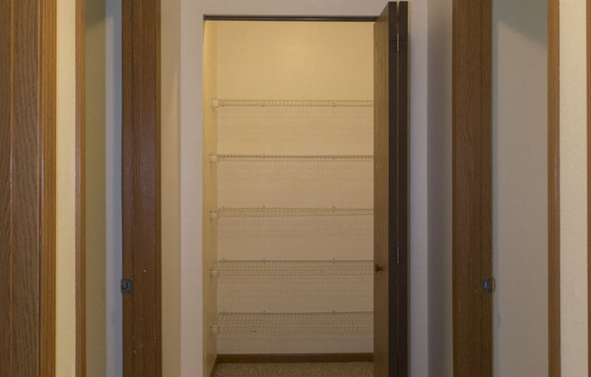 The hall closet in this Meredith Homes 3 bedroom apartment is HUGE.