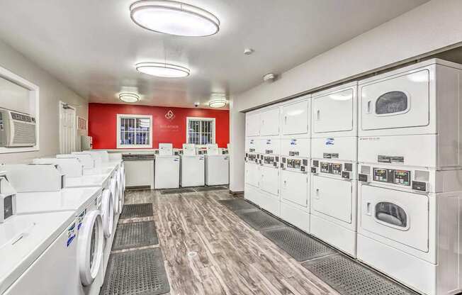 A row of washing machines in a laundromat.