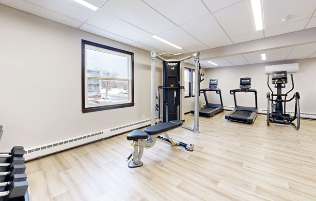 fitness center with cardio and lifting equipment