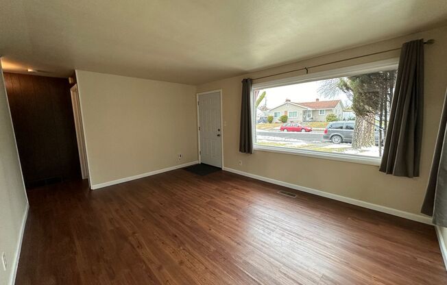 Cozy and Conveniently Located 2 Bed 1 Bath Spokane Home w/ Detached Garage & Heated Multipurpose Room!