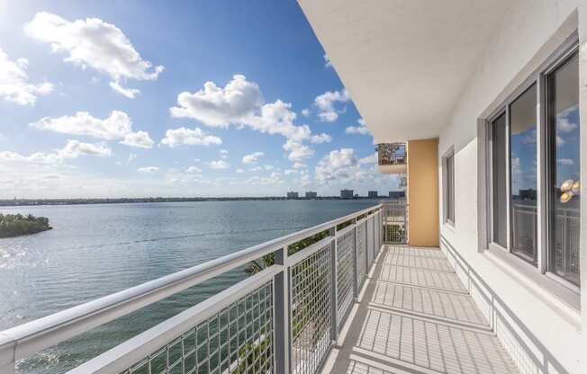 the view from the balcony of a condo overlooking the water