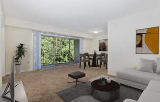 a living room and dining room with a couch and a table