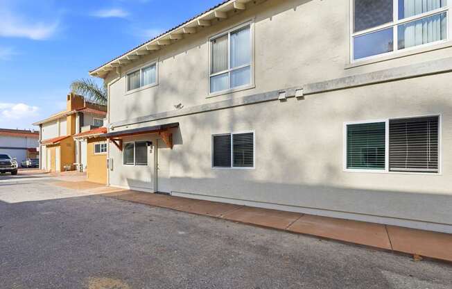 A building with a yellow door and windows.