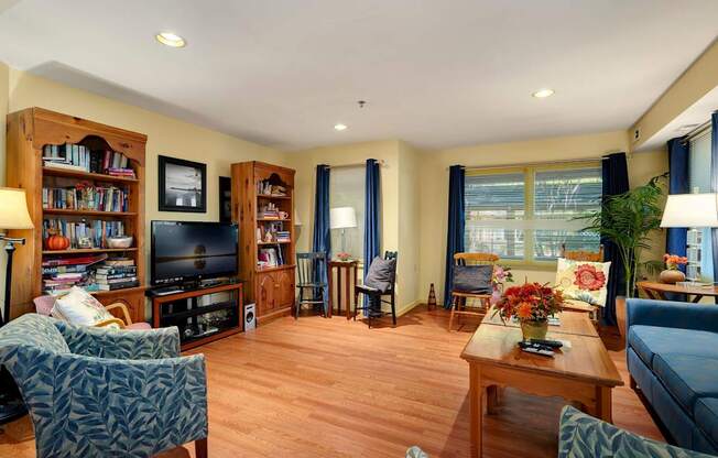 a living room filled with furniture and a tv