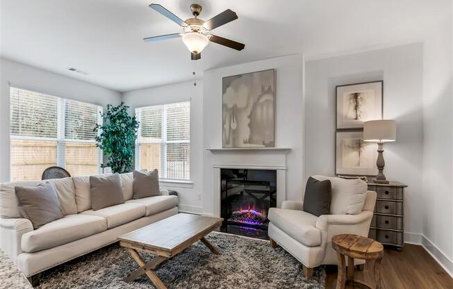 a living room with two couches and a fireplace