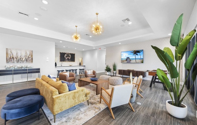 a living room with couches and chairs and a fireplace