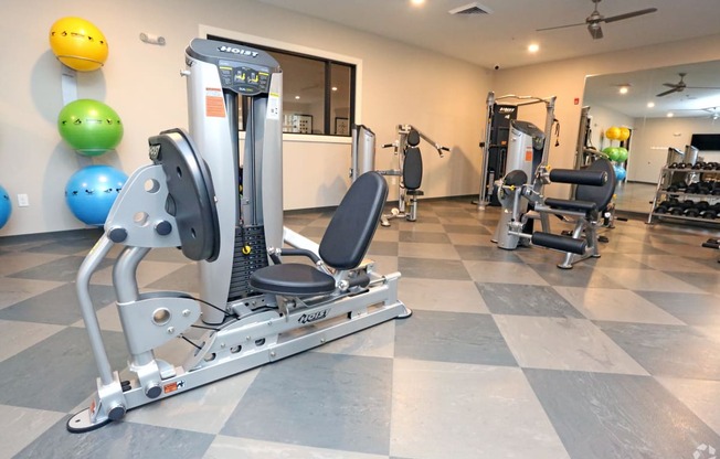 a gym with cardio equipment and weights in a home gym at Century Baxter Avenue, Louisville, 40204 