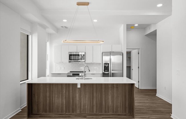 a kitchen with a counter top and a refrigerator