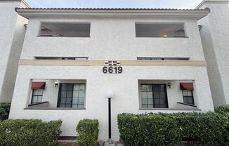 Centrally located beautiful second story condo in quiet community with vinyl plank flooring and beautiful custom showers!