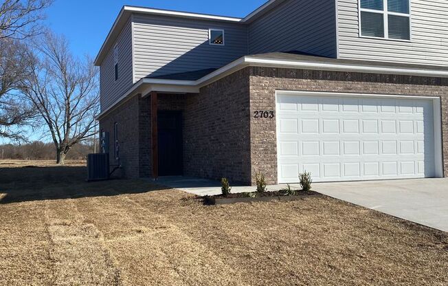 *Preleasing* Three Bedroom | Two and a Half Bathroom Duplex with Full Service Lawn Care in Siloam Springs