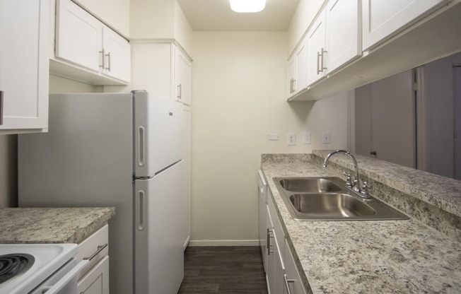 This is a photo of the kitchen of the 864 square foot 2 bedroom apartment at The Biltmore Apartments in Dallas, TX.