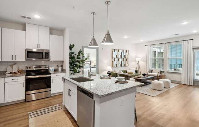 an open kitchen and living room with a large island