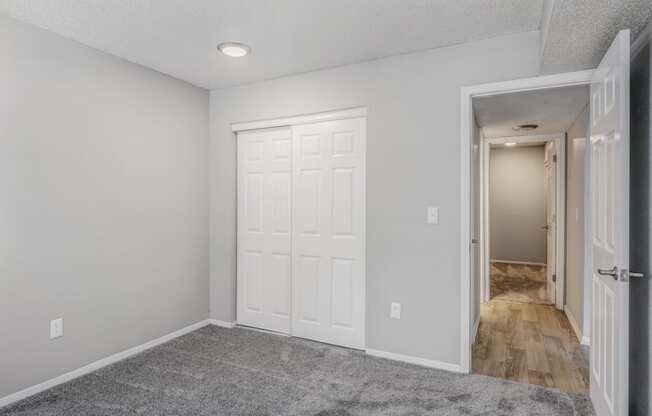 Bedroom with upgraded carpet at The Life at Highland Village, Missouri, 64129