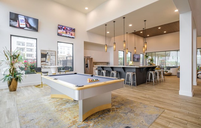 social lounge with billiards at Reveal Skyline apartments