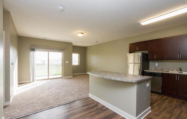 a large kitchen with stainless steel appliances
