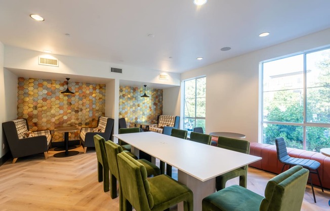 a conference room with a white table and chairs