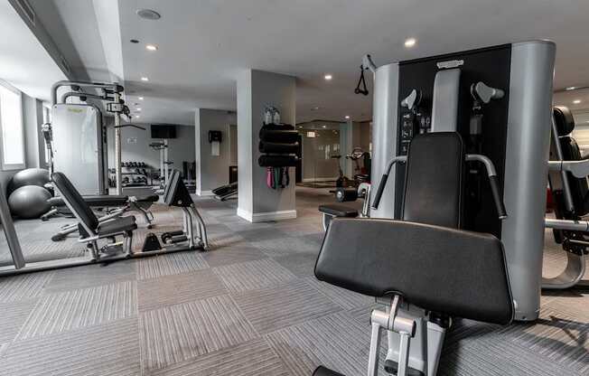 a gym with weights machines and other workout equipment