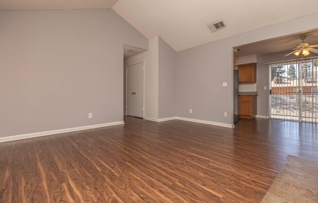 a large empty room with a wooden floor