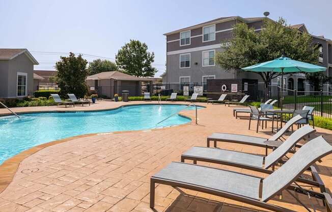 our apartments have a large pool and lounge chairs