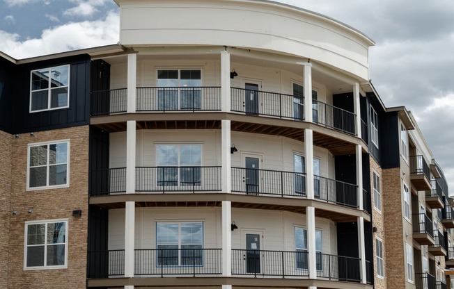 a view of a building with balconies on the side of it