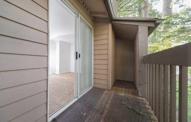 the deck has a sliding glass door to the living room