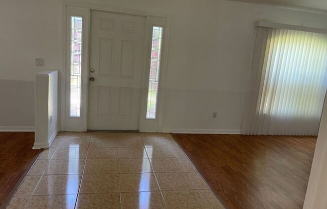 Beautiful 3/2/2 house with laminate floors, tiles, screen porch, luscious lawn, sprinkler system and much more.