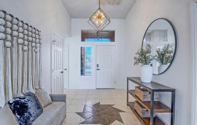 Beautiful single-story open-concept partially furnished home with a sparkling pool and no rear neighbors!