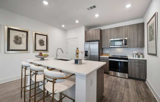 the residence on lamar apartment kitchen with island and stools