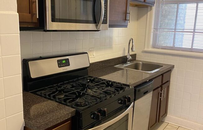 Bright and Sunny Top Floor ~ One Bed/One bath ~ Heat Included ~ Pets Welcome