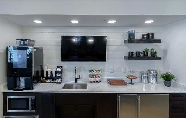 Coffee bar in the resident lounge  at Two Addison Place Apartments , Pooler, GA, 31322