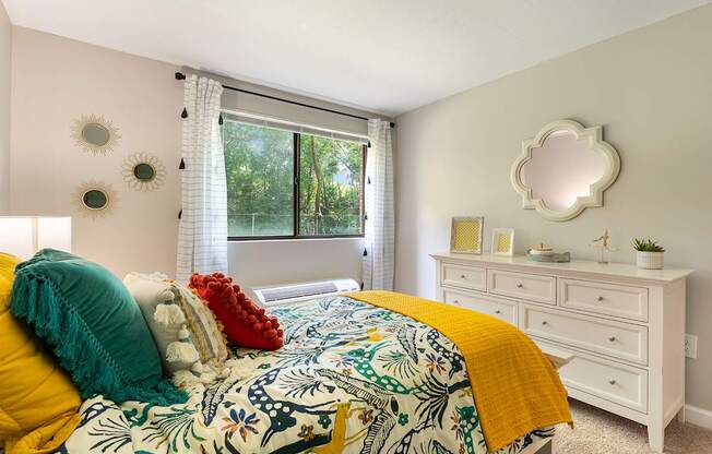 Expansive bedroom with room for a queen-size bed, additional furniture, and large closets.