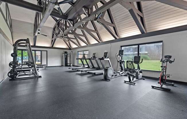 A spacious gym with a variety of exercise equipment.