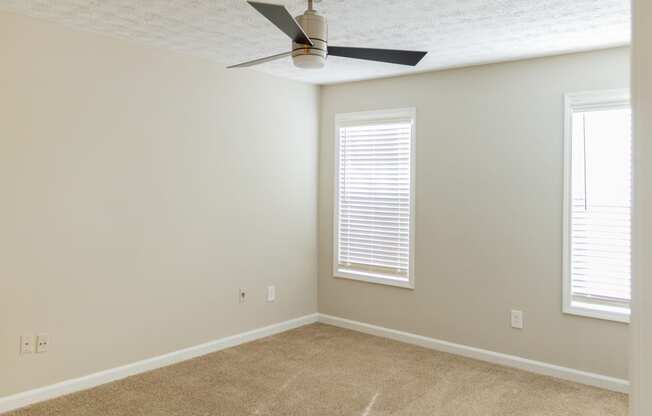 Ceiling fan and plush carpet at Twin Springs Apartments, Norcross, GA