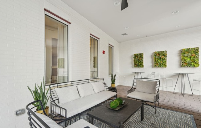 a living room with a couch and two chairs