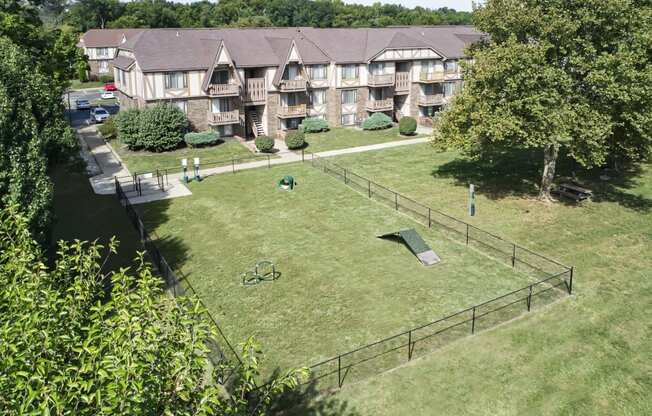 an aerial view of the backyard of an apartment complex