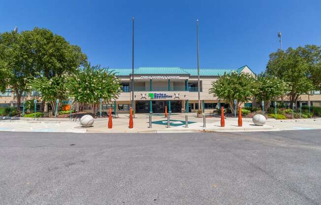 a building with a green roof and orange pillars in front of it at Fairmont at South Lake, Bowie, 20716