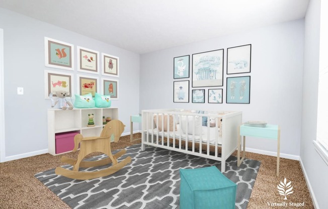 a nursery with blue walls and a white crib with a rocking chair and a blue ott