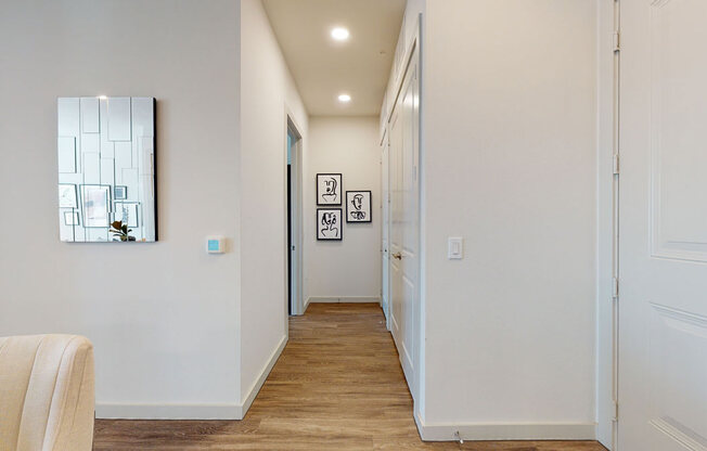 a hallway with a mirror on the wall