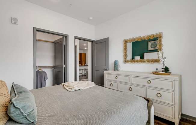a bedroom with a bed and a dresser at Prism at Diamond Ridge, Moon Township, PA
