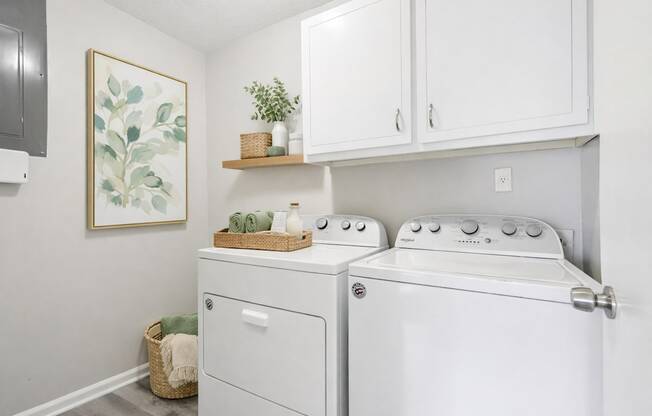 A laundry room with a washer and dryer.