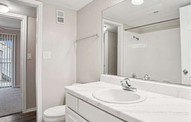 Unfurnished A4 floor plan bathroom with a sink, mirror and a toilet Noel on The Parkway in Dallas, TX