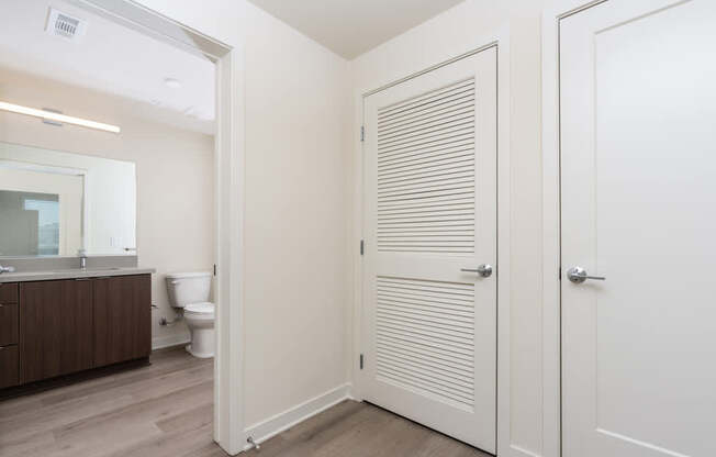 A white bathroom with a toilet and sink.