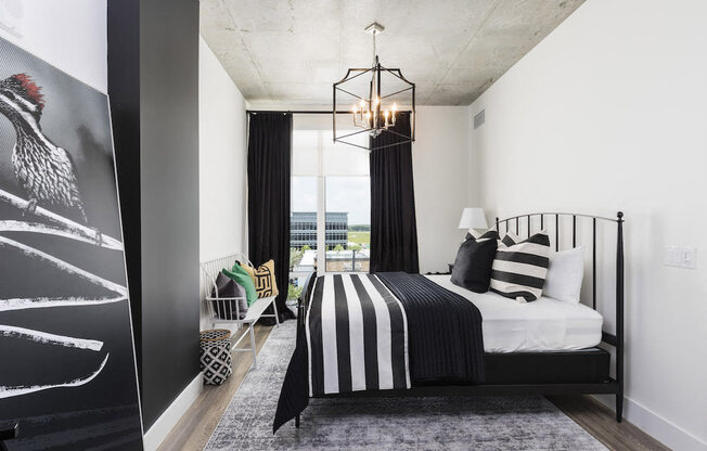 bedroom with large windows and modern chandelier at Lake Nona Pixon, Orlando, FL, 32827