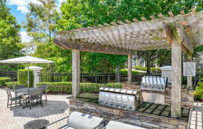 an outdoor grilling station at Verano apartments