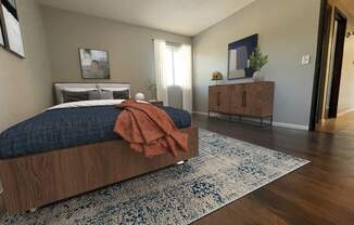 a bedroom with a bed and a dresser