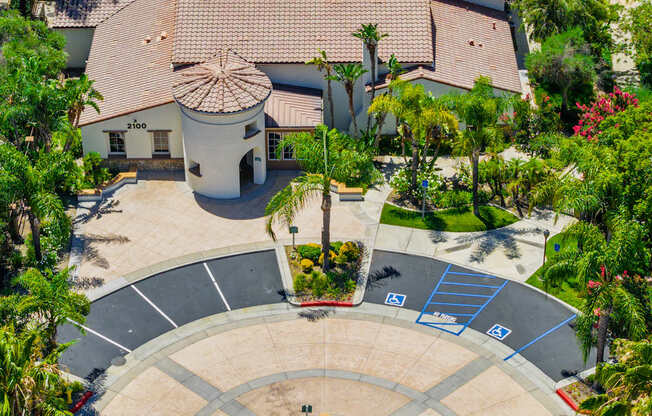 A large outdoor swimming pool surrounded by a circular walkway.