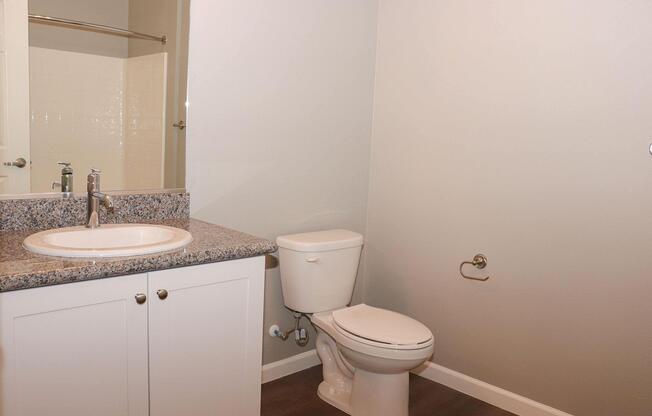 a room with a sink and a mirror