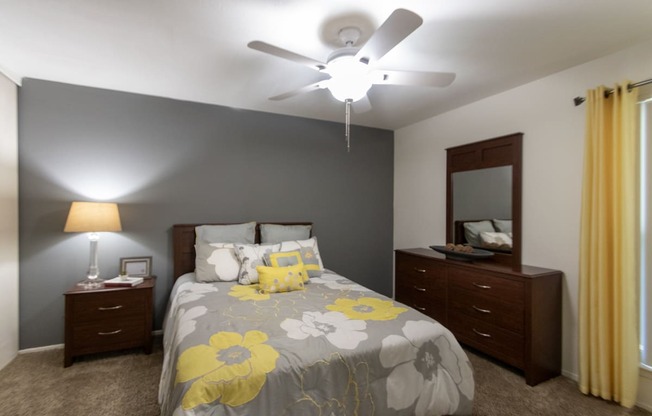 This is a photo of the bedroom of the 590 square foot 1 bedroom, 1 bath model apartment at The Biltmore Apartments located int he Vickery Meadow neighborhood of Dallas, TX.